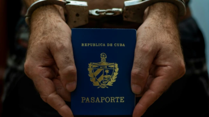 hands handcuffed holding passport